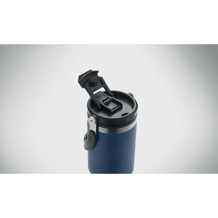 A dark blue drink bottle with a black flip-top lid and a silver band around the neck, featuring a logo.
