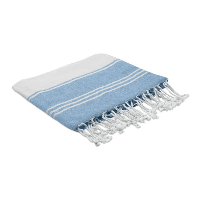 A folded blue and white patterned towel with fringed edges, featuring stripes in light blue. It has a simple design.