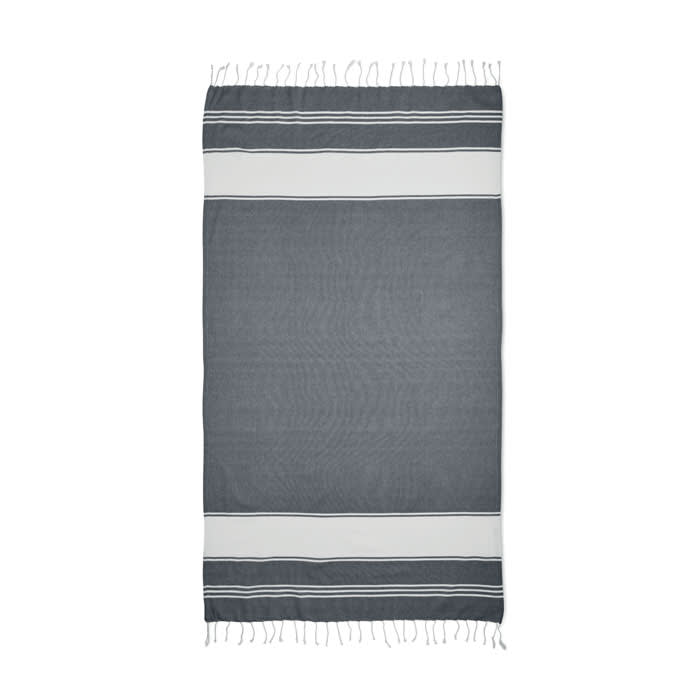 A towel featuring a grey design with white stripes and fringed edges. It includes a logo on the material.