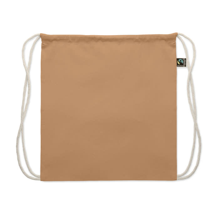 A drawstring backpack in a tan colour with white cords and a logo tag on the side.