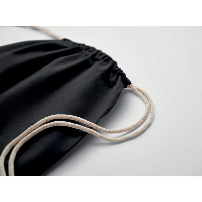 A black drawstring bag with beige cords, featuring a gathered top for closure.