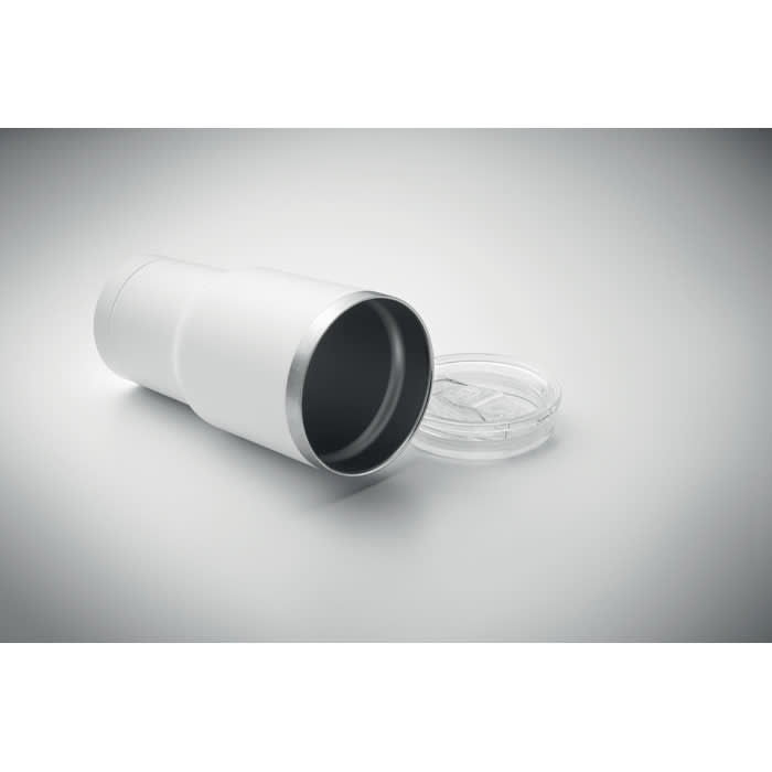 A drink bottle in white with a silver rim, lying on its side with a clear lid resting nearby.