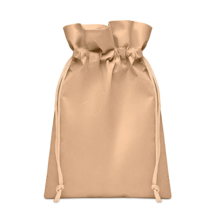 A tan drawstring bag with a gathered top and two cords for closure. The bag has a smooth texture.