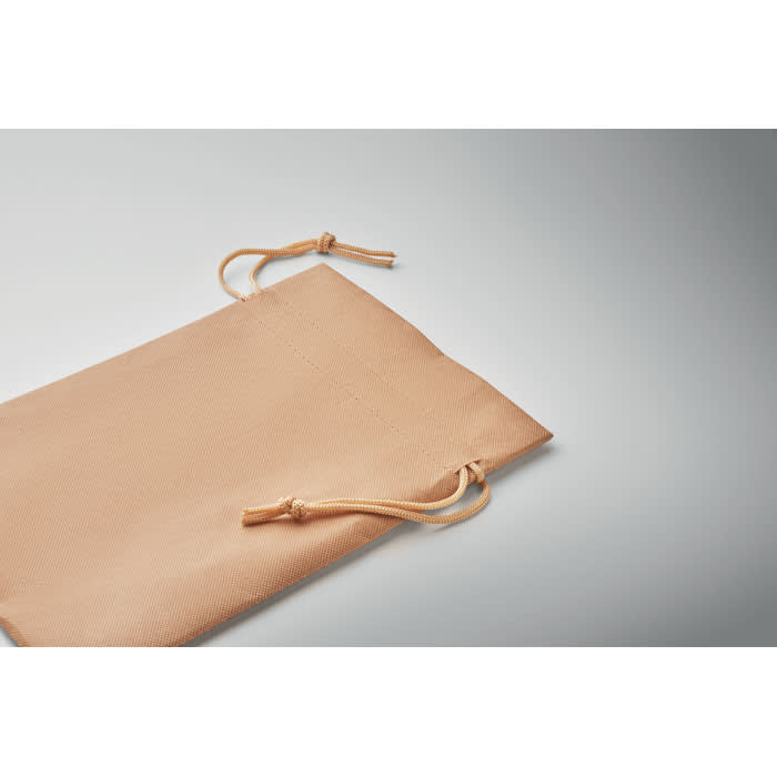 A beige drawstring pouch made of fabric, featuring two adjustable cords at the opening.