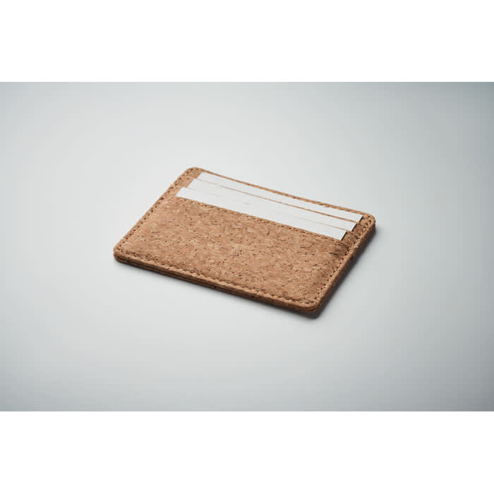 A cardholder made of natural cork, featuring a simple design with slots for cards.