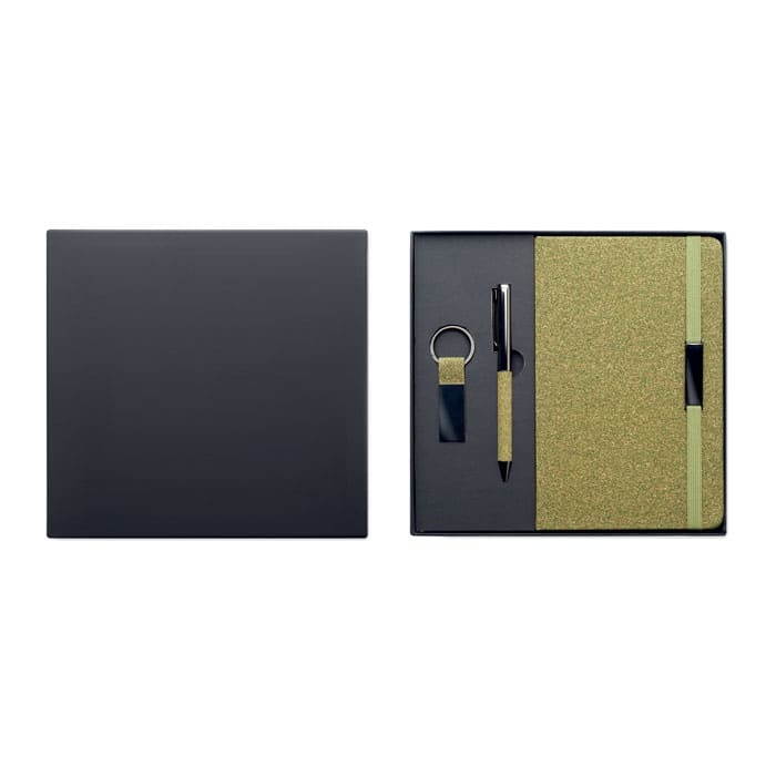 A gift set featuring a pen, keyring, and notebook in green, presented in a sleek black box.