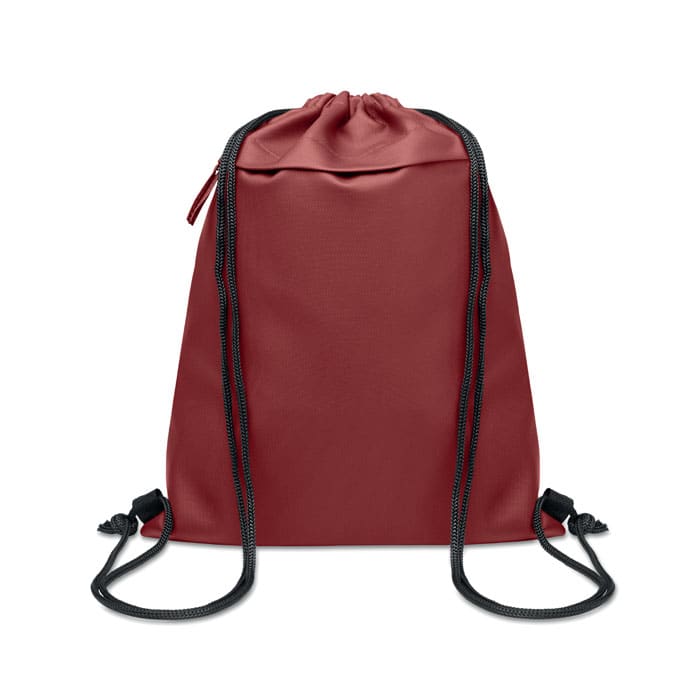 A drawstring bag in a deep red colour with black cord straps and a zipped pocket at the top. It features a logo.