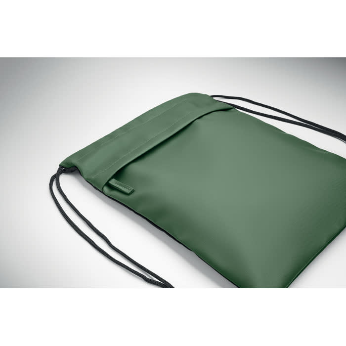 A green drawstring bag with a smooth finish and black cords for closure, featuring a branding logo.