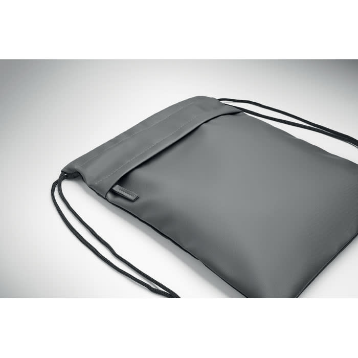 A grey drawstring bag with a sleek, minimalist design featuring a logo.