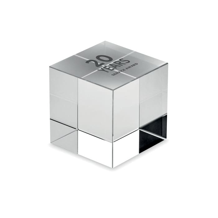 A mirrored cube award with engraved text celebrating 20 years of service. It features a shiny, reflective finish.