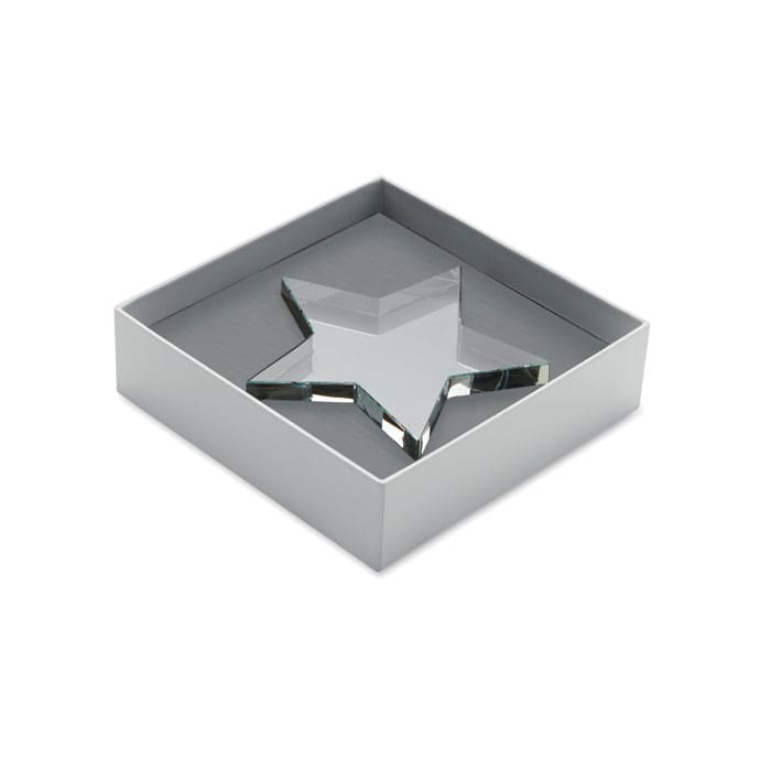 A star-shaped crystal object placed inside a grey gift box, featuring a reflective surface.