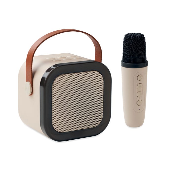 A portable speaker in beige with a brown handle and a matching microphone, both featuring sleek designs.