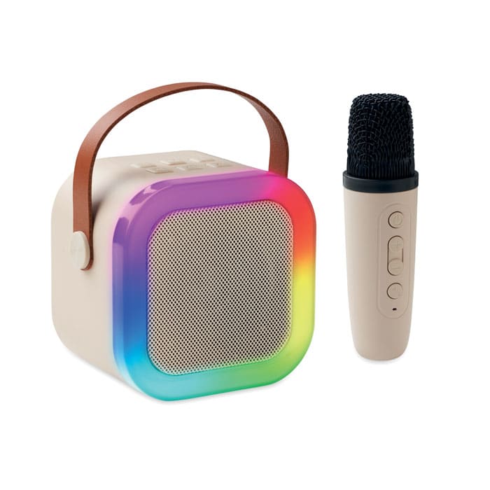 A portable speaker with a rainbow LED border and a detachable microphone, featuring a tan body and a brown handle.