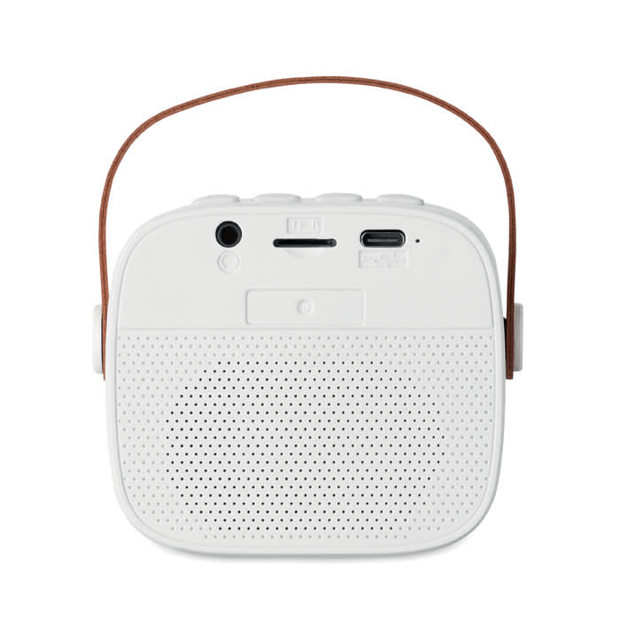 A portable speaker in white with a textured front, featuring a handle and multiple connection ports on the back.