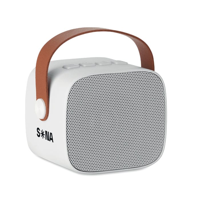A portable speaker in white with a brown handle and a mesh front. It features a logo on the side.