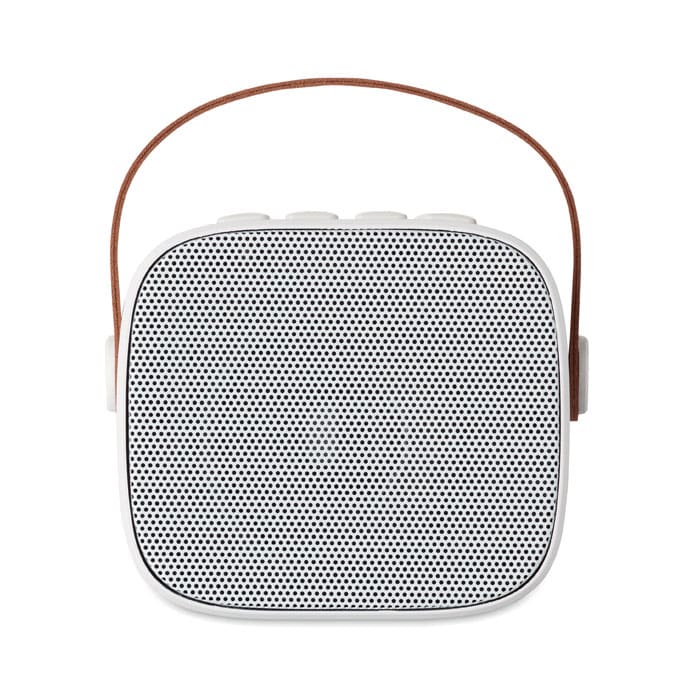 A portable speaker with a white body and a brown strap, featuring a perforated grid design on the front.