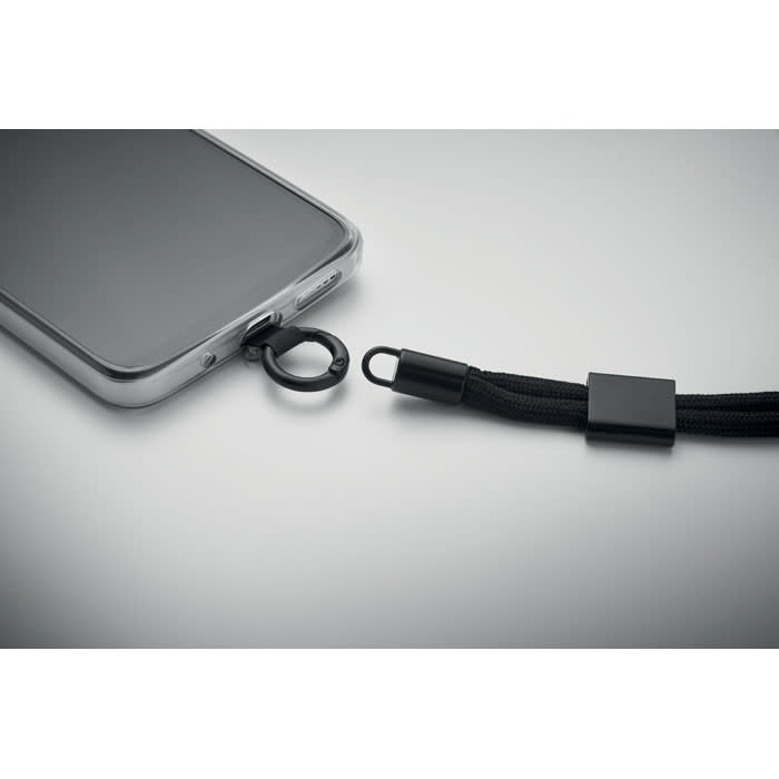 A black wrist strap connected to a device with a circular attachment, featuring a sleek and minimalistic design.