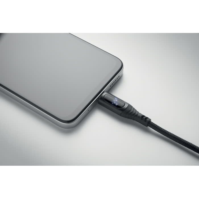 A black charging cable connected to a smartphone, showcasing a sleek design and modern aesthetics.