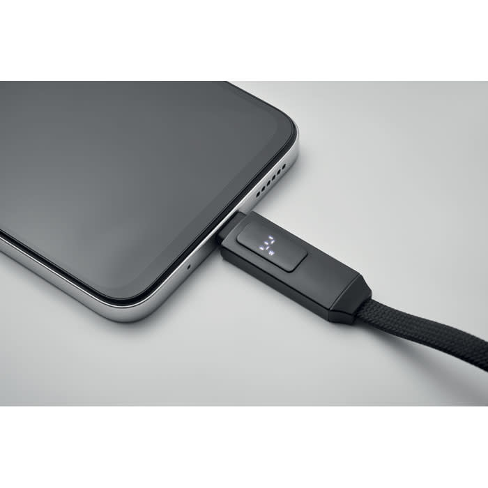 A charging cable connected to a smartphone, featuring a textured black design and a logo on the connector.