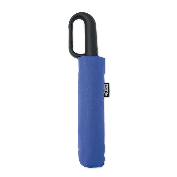 A compact blue umbrella with a black handle, featuring a sleeve for easy storage. It has a small branding label.