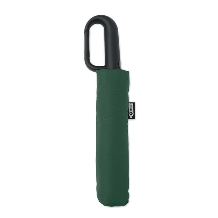 A compact green umbrella with a black handle, featuring a protective sleeve. It has a branding label on the sleeve.