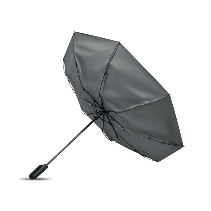 A grey umbrella with a black handle, featuring a sleek design and a sturdy frame. It has branding on the handle.