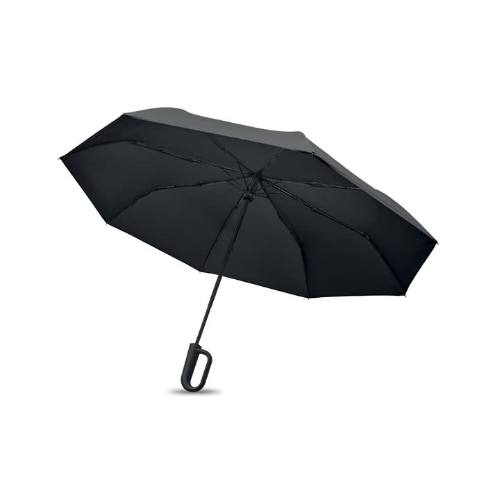 A black umbrella with a curved handle, opened to display its canopy and structure. It features branding on the handle.
