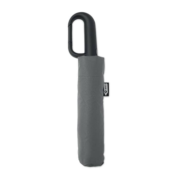 A grey umbrella with a black handle, featuring a storage sleeve and a logo tag.