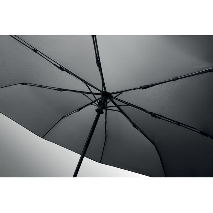 A black umbrella with a sturdy frame and multiple ribs, showcasing its interior structure.