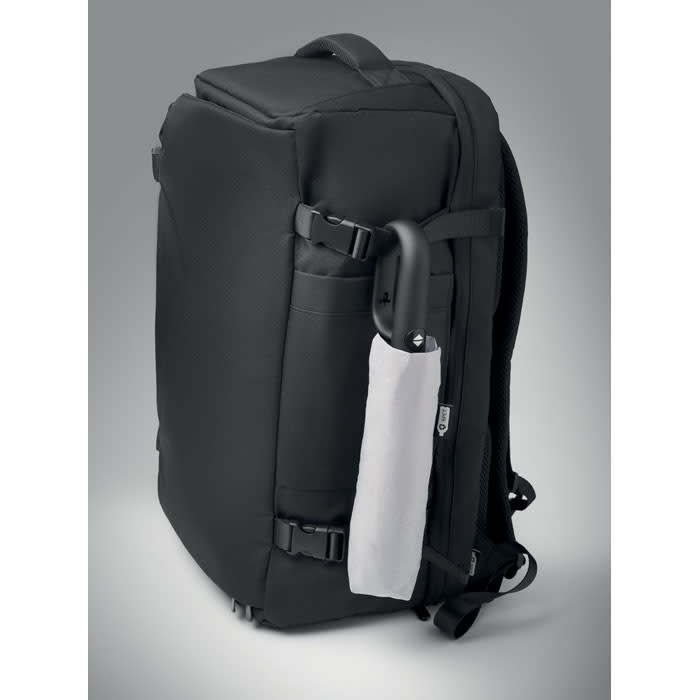 A black backpack featuring adjustable straps and a side pocket with a grey item partially visible. It has a logo.