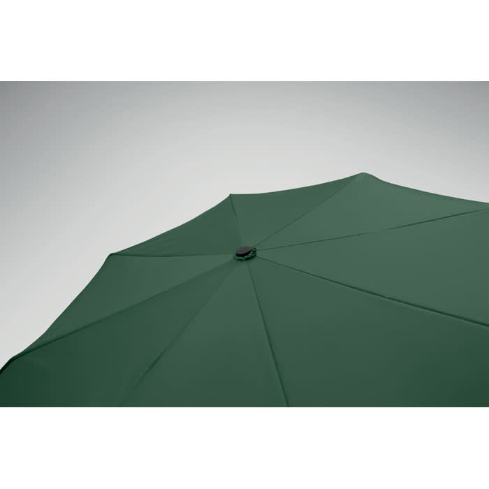 A green umbrella with a central hub, featuring a plain design and no visible branding.