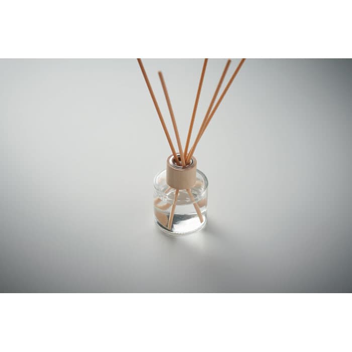 A glass diffuser bottle with wooden reeds, filled with clear liquid, and featuring a light wooden cap.