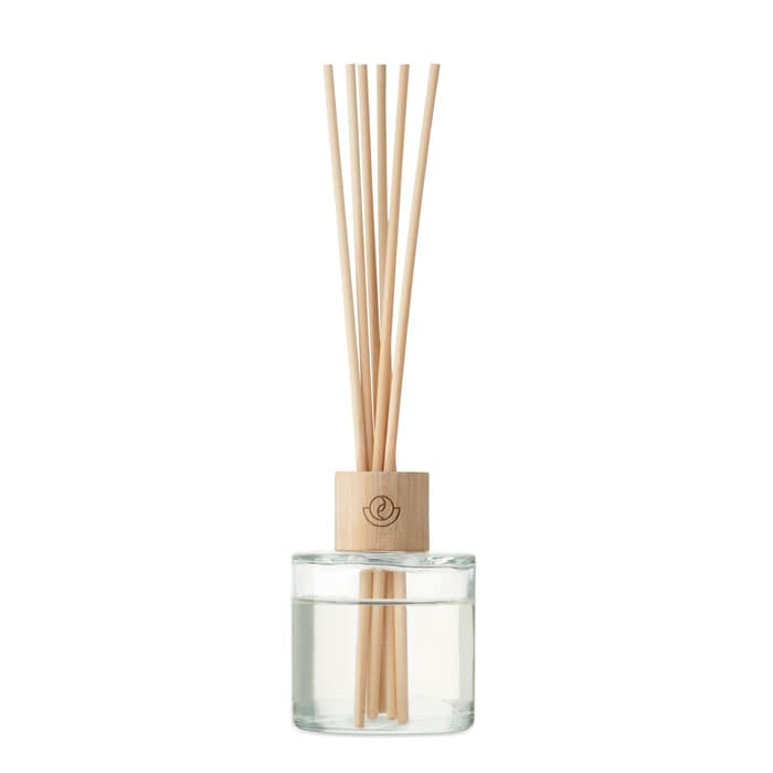 A drink bottle with a clear liquid and wooden reeds, featuring a light wooden base and a logo.
