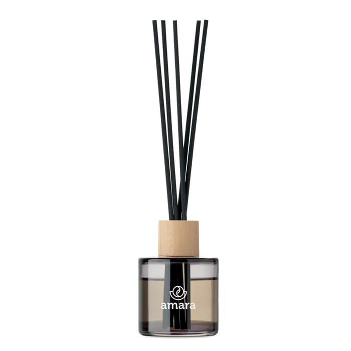 A diffuser bottle with a black and clear design, featuring wooden and black reed sticks, and a logo on the front.