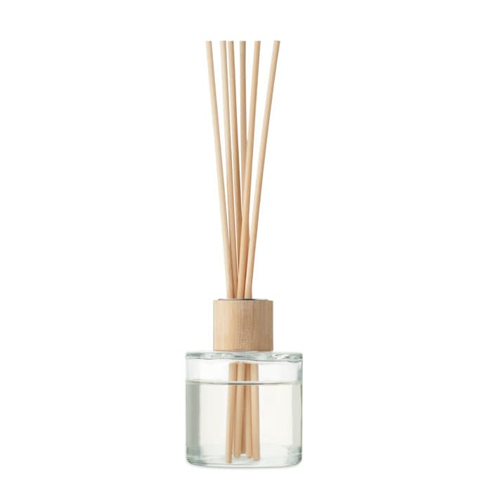 A glass diffuser with wooden reeds, containing a clear liquid. The base is made of natural wood.