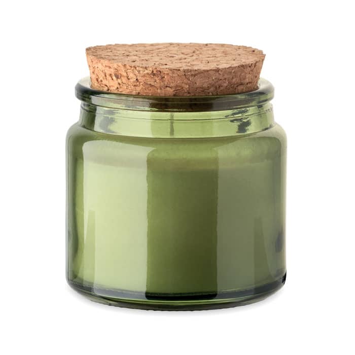 A green glass candle jar with a cork lid, showcasing a smooth, waxy interior.