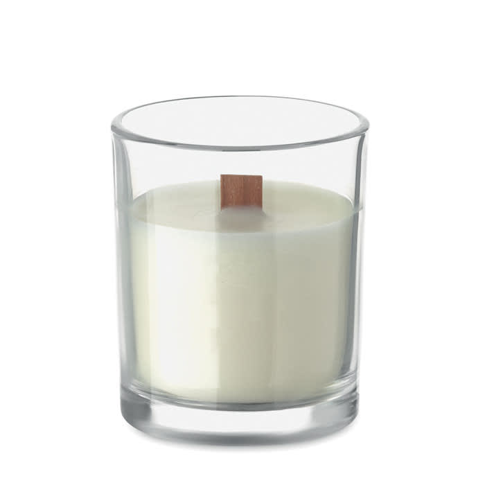 A candle in a clear glass holder, featuring a wooden wick and a creamy white wax.