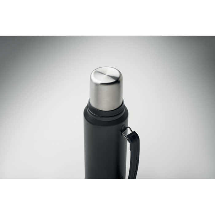A drink bottle in matte black with a stainless steel cap and a carrying handle. It features a logo.