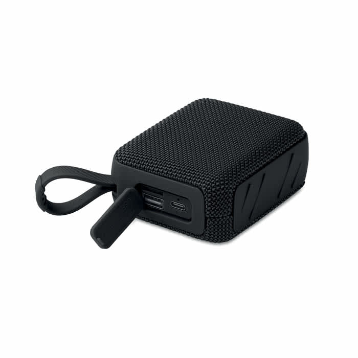 A portable charger in a textured black casing, featuring USB and USB-C ports and a built-in handle.