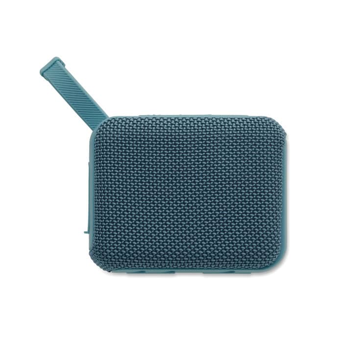 A compact teal speaker with a textured fabric exterior and a loop for easy carrying.