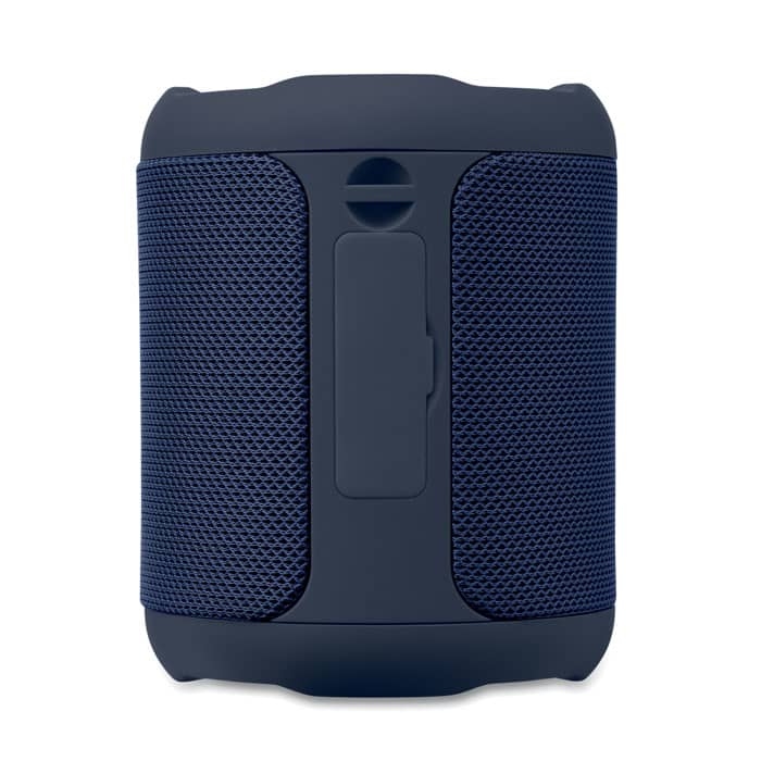 A portable speaker in navy blue with a textured mesh design and a side control panel. It has a logo on the front.