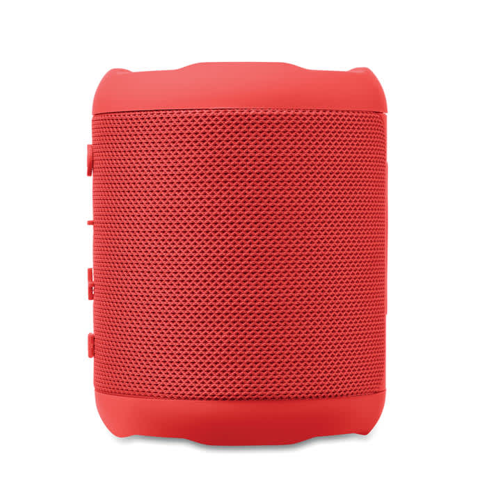 A red portable speaker features a textured mesh design and buttons on the side, with a branding logo visible.
