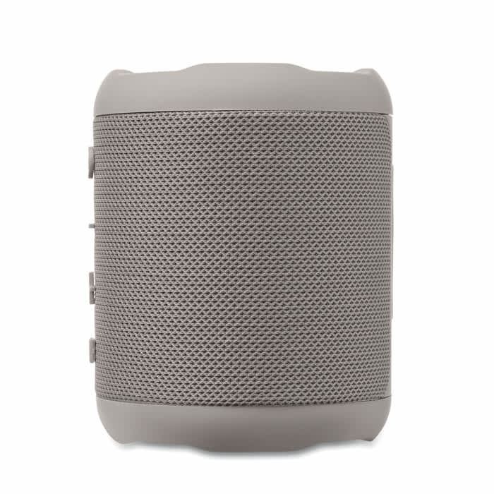 A portable speaker in a light grey finish with a textured mesh design and control buttons on the side.