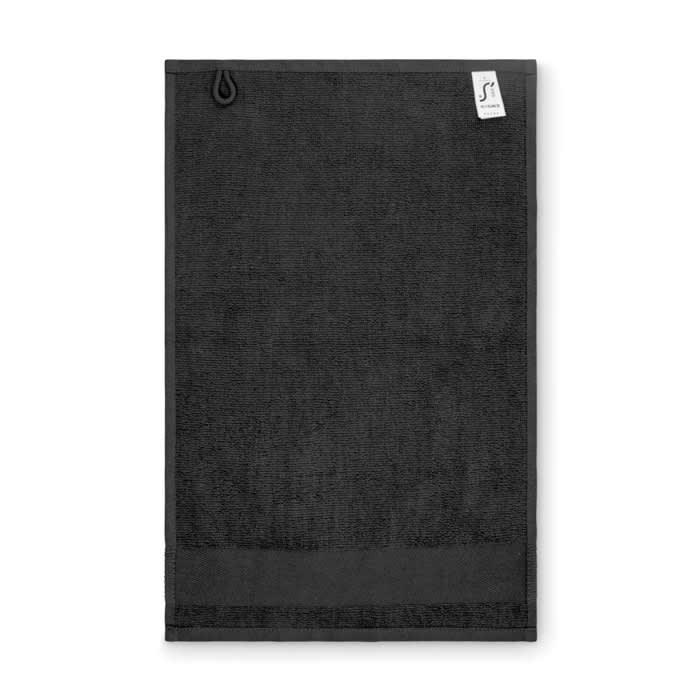 A black towel with a hanging loop and a small label attached at the top corner.