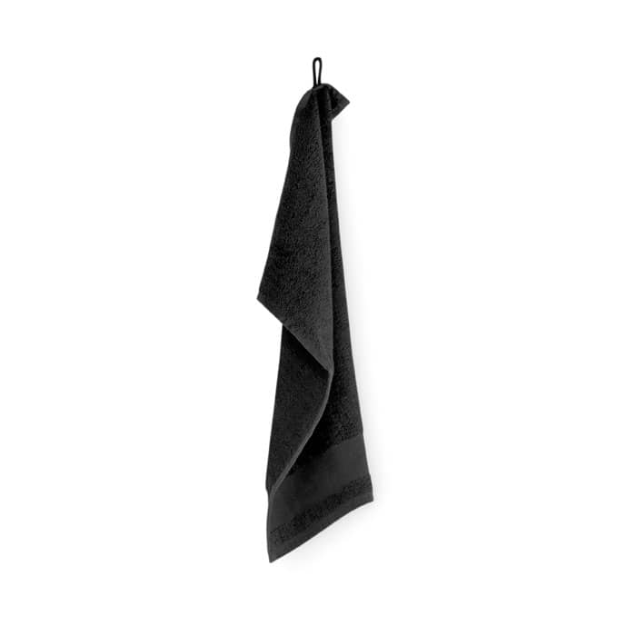 A black towel hanging on a hook, featuring a loop for easy hanging.