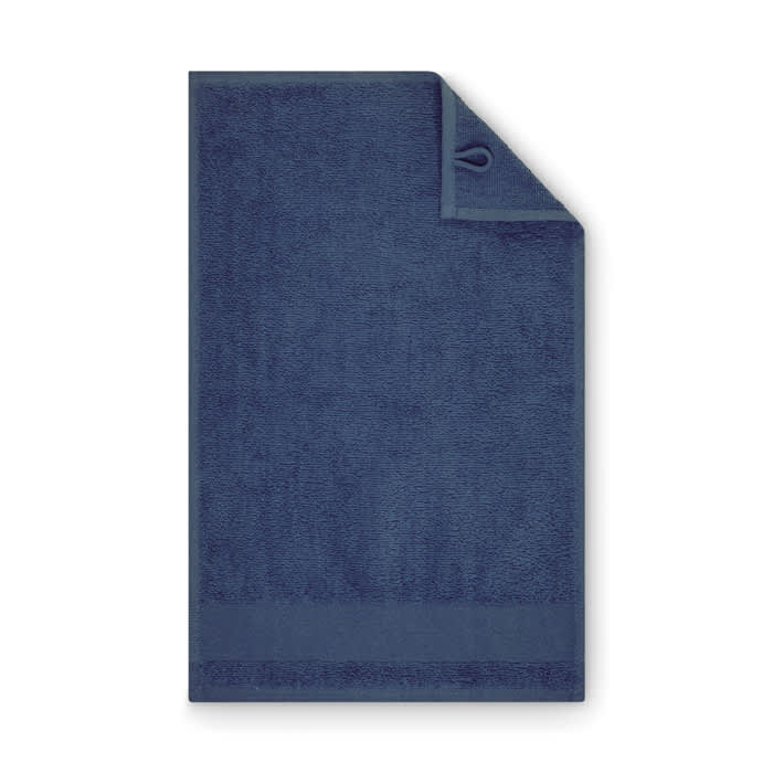 A navy blue towel with a flat edge and a hook for hanging. It has a simple, textured surface.