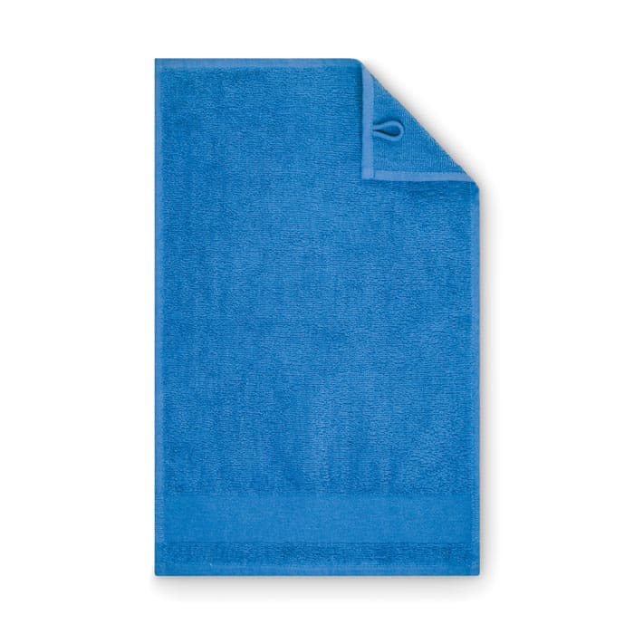A blue towel with a loop for hanging. The fabric appears soft and plush, suitable for drying or covering.