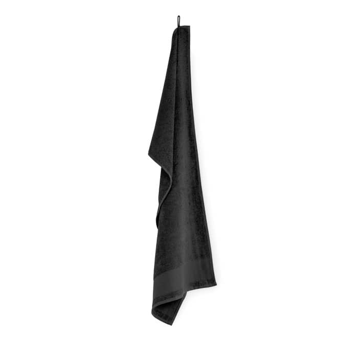 A black towel hanging from a hook, made of soft, fluffy fabric. The towel features a simple, elegant design.