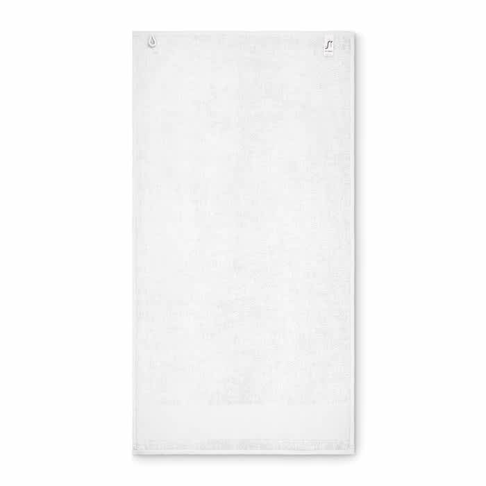 A white towel with two hanging loops, featuring a subtle branding logo in one corner.