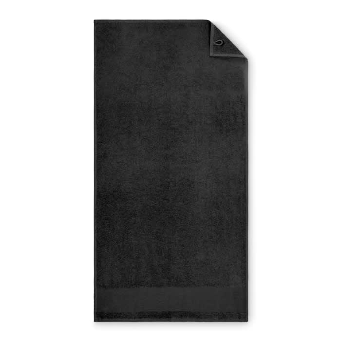 A black towel with a folded corner, featuring a loop for hanging. It has a soft texture and is a solid colour.